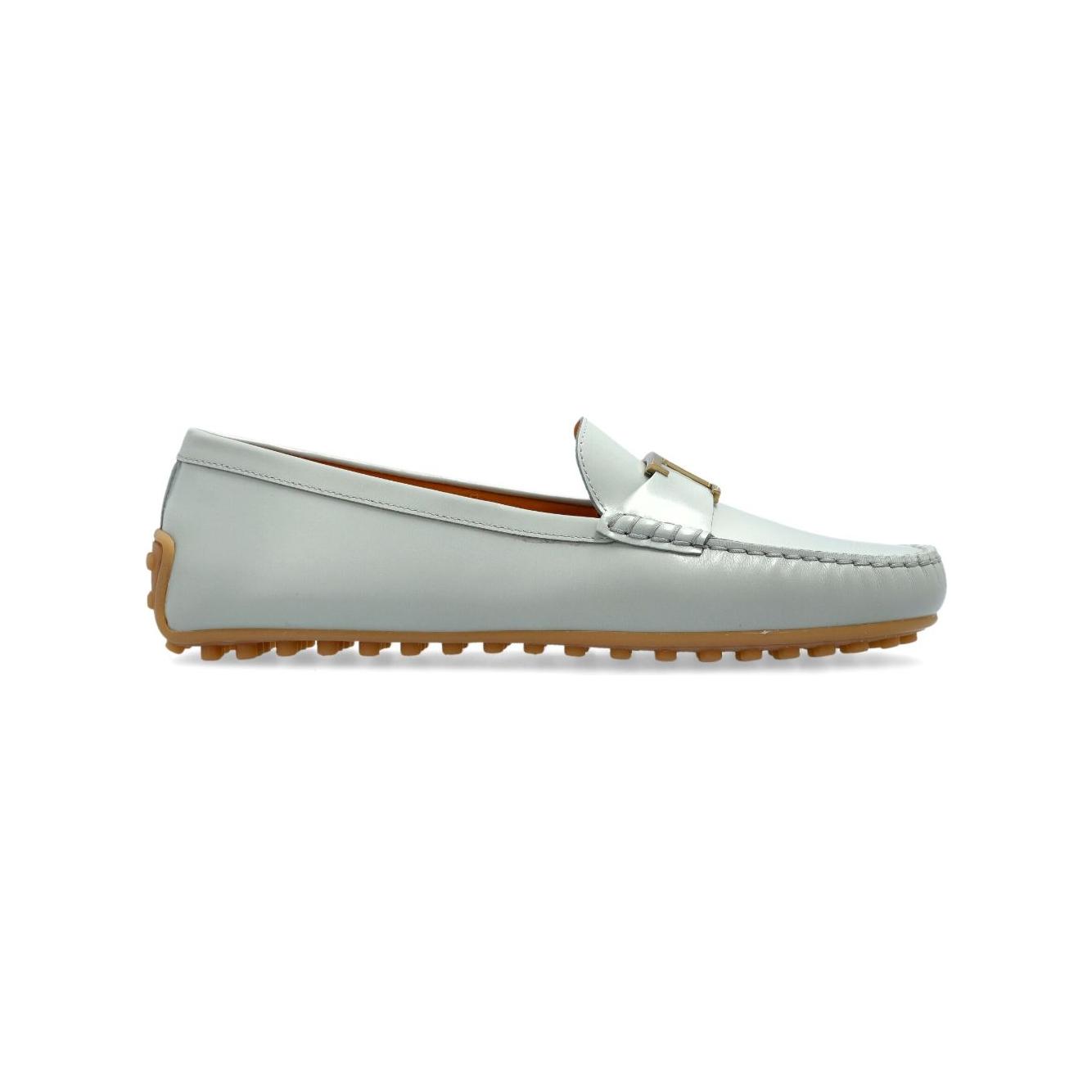 Light blue Tod's flat shoes with round toe, gold-tone hardware, slip-on style, and flat sole - City Gommino loafers