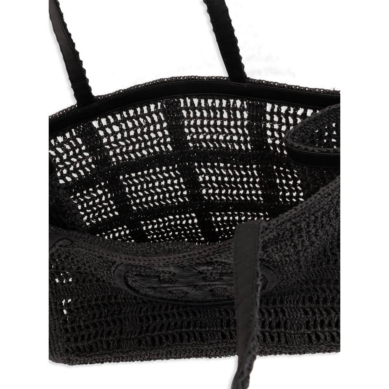 Black raffia Tory Burch Large Ella Crochet Tote Bag with signature Double T motif and long top handles, showing interior view.