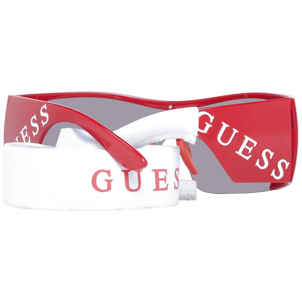 Guess red women's sunglasses with grey mirrored lenses and red plastic frame, includes branded case and eyewear cord.