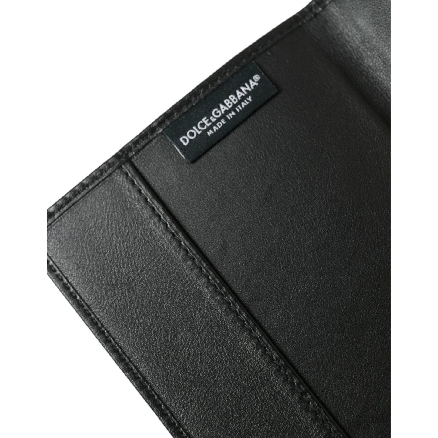 Dolce & Gabbana black crocodile leather bifold passport holder featuring logo plaque, made in Italy, luxury travel accessory.