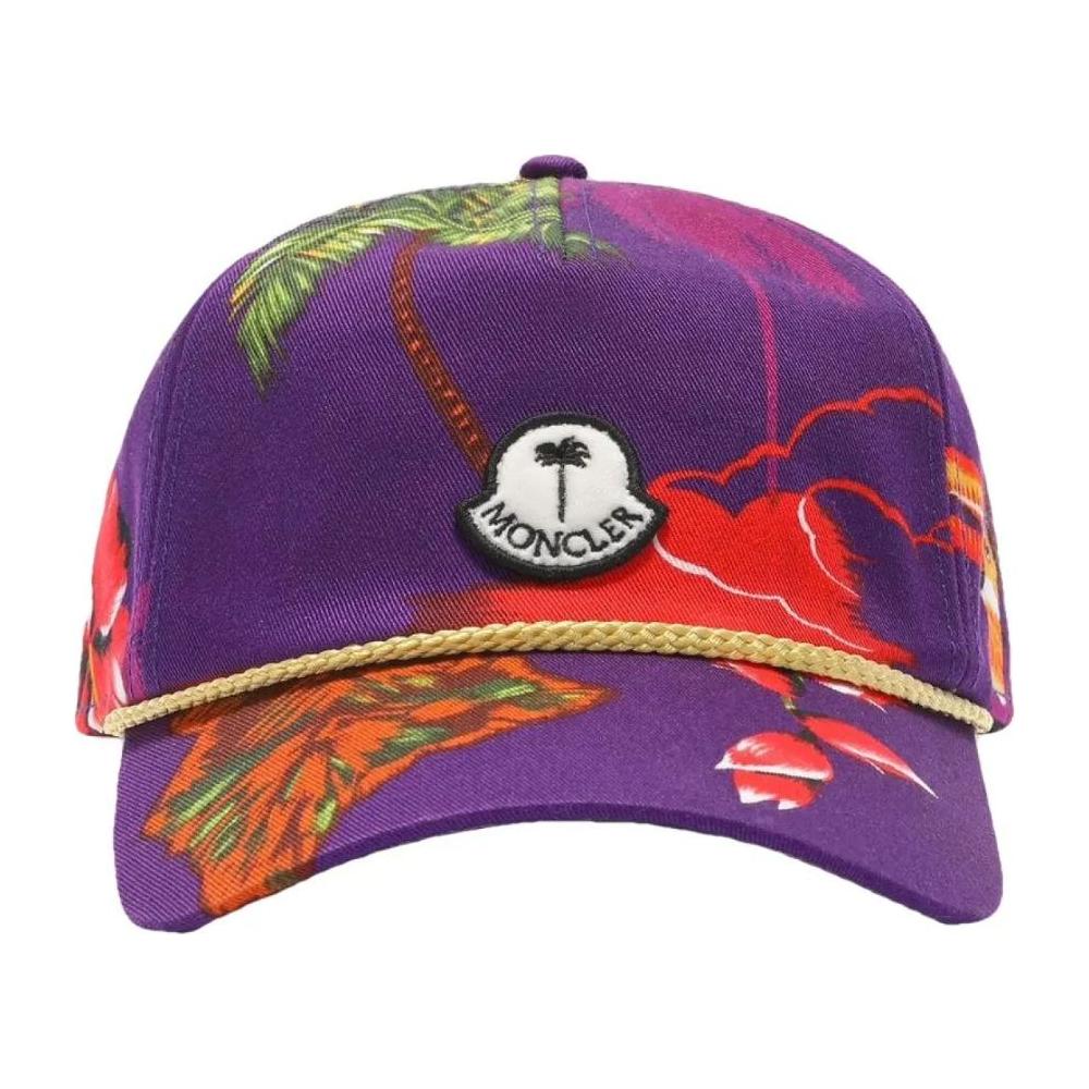 Moncler x Palm Angels purple baseball cap with floral print, Moncler logo, and gold decorative rope on visor.