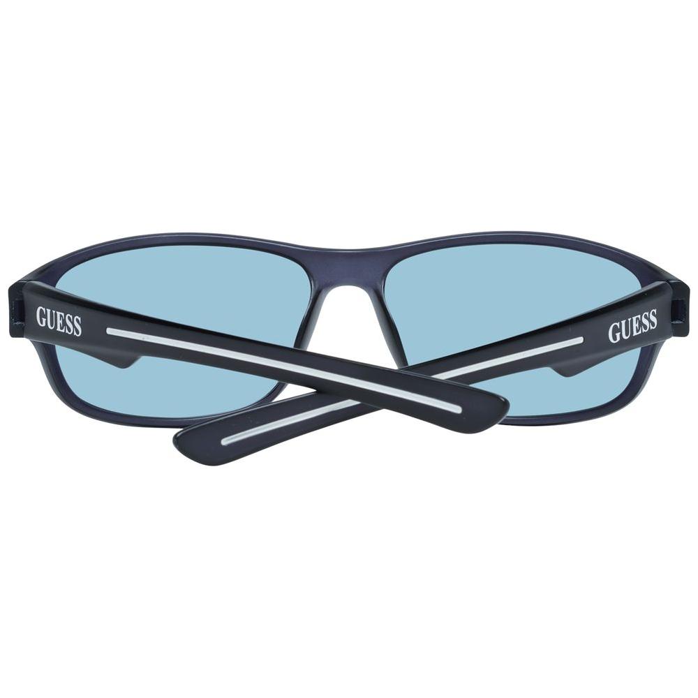 Guess gray women's sunglasses with plastic full-rim frame, blue gradient lenses, and UVA/UVB protection. Includes branded case.