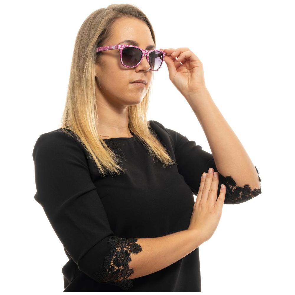 Woman wearing Joules pink sunglasses with rose frame and grey gradient lenses, offering UVA & UVB protection, size 54-17-145.