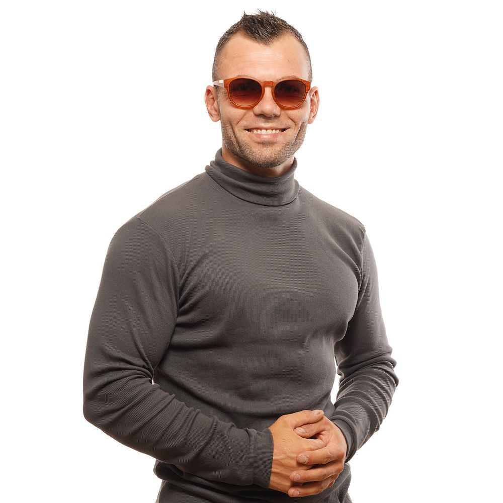 Man wearing Bolle Brown Unisex Sunglasses with round lenses and full-rim plastic frame, providing 100% UVA & UVB protection.