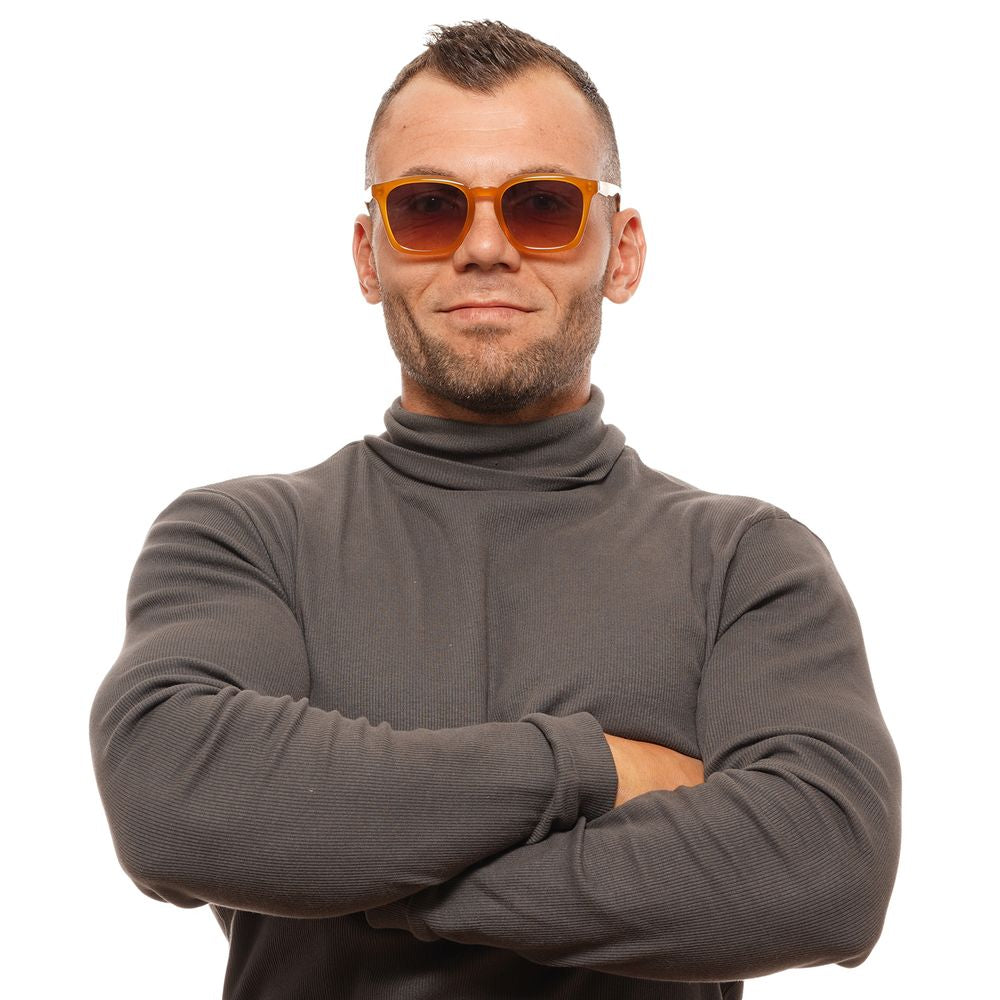 Man wearing Scotch & Soda yellow square sunglasses with gradient brown lenses and full-rim acetate frame.