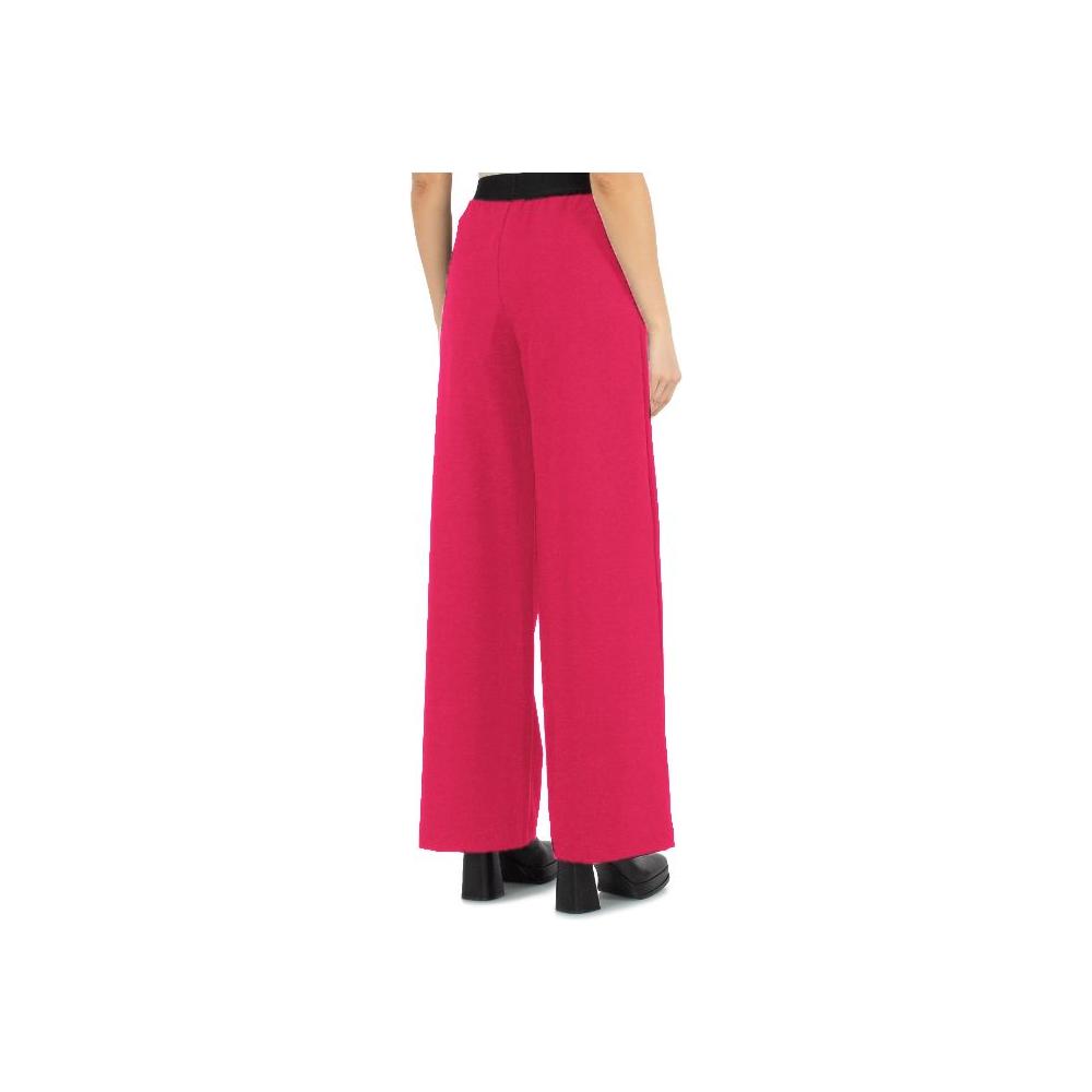 Fuchsia Comme des Fuckdown satin pants with logoed elastic waistband, side view showcasing fit and pockets.