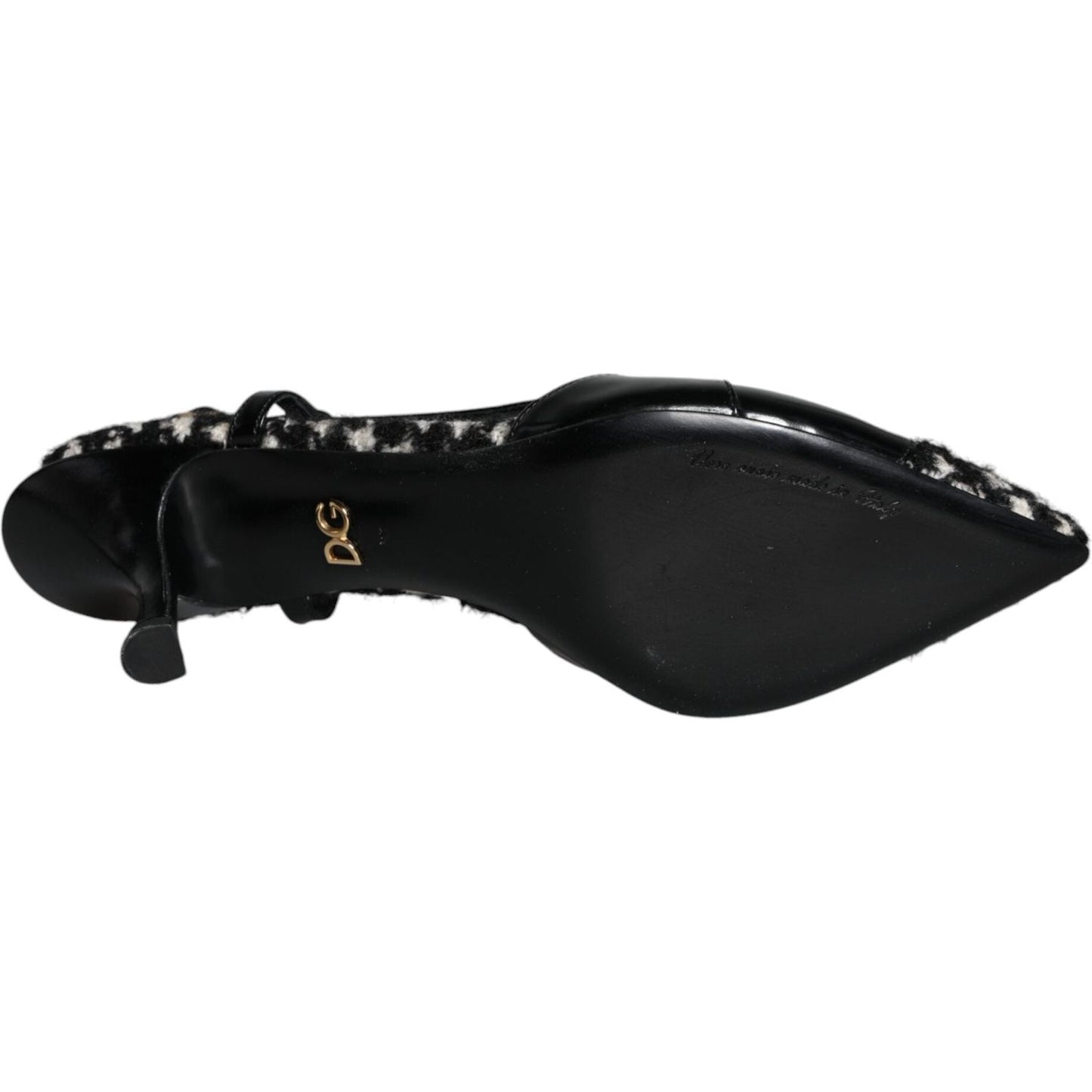 Underside view of Dolce & Gabbana black leather houndstooth slingback shoe with logo detail and smooth sole.