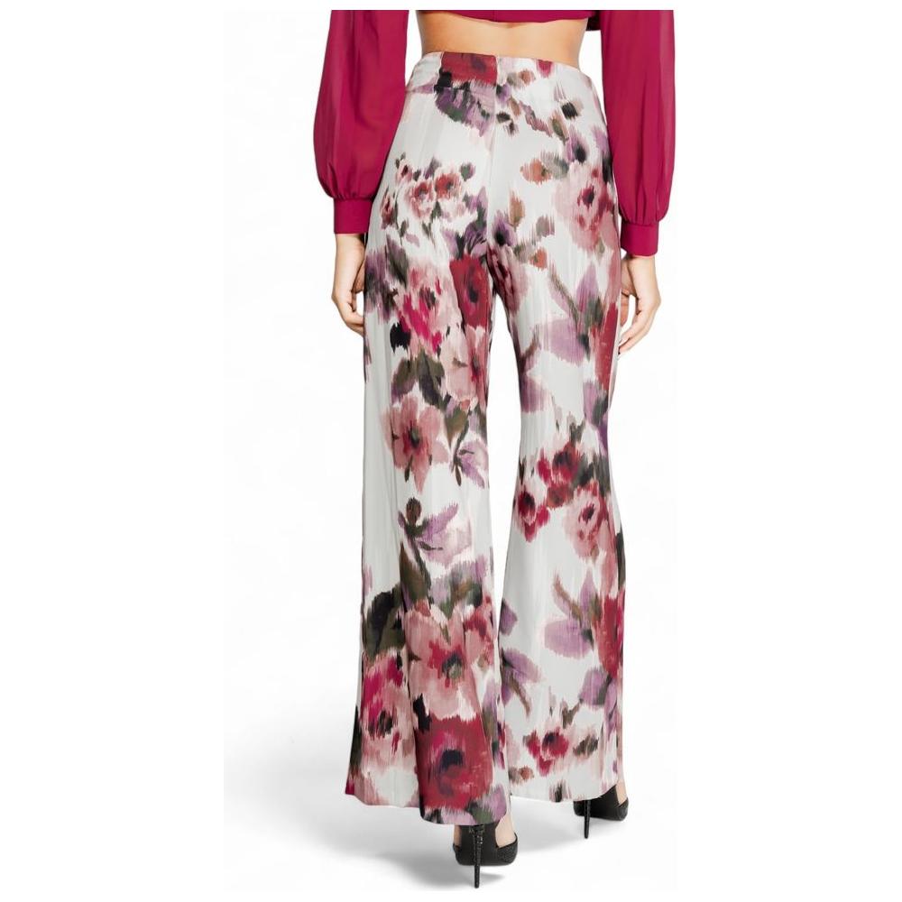 Model wearing floral Rinascimento Bordeaux polyester women's pants, part of the fall/winter collection.