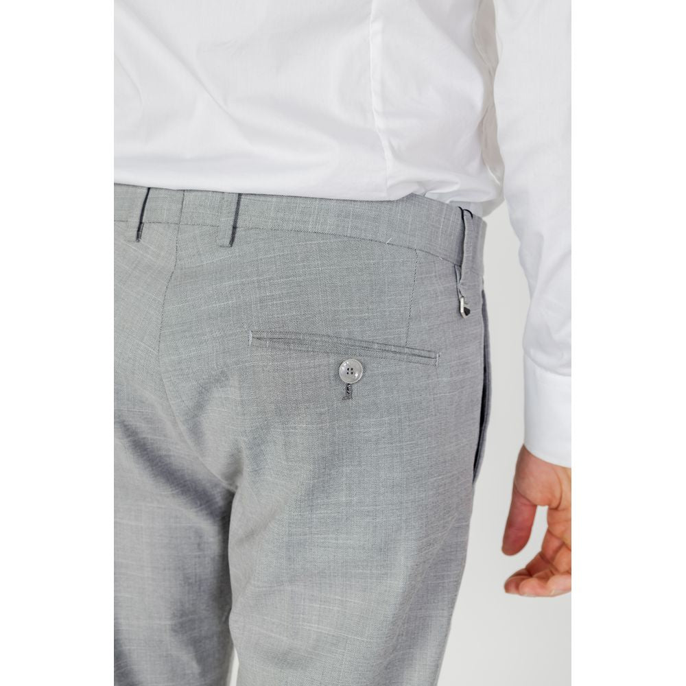 Back view of Antony Morato gray polyester men's suit pants, spring/summer collection, showing button detail and fabric texture.