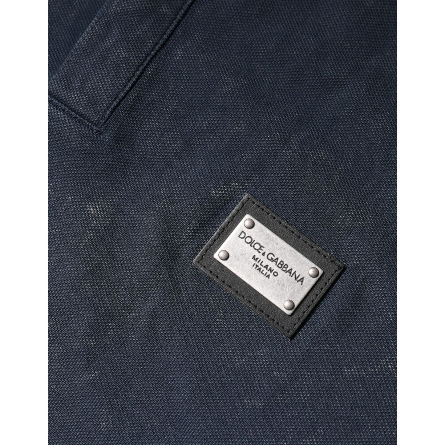 Dolce & Gabbana dark blue polo shirt with metal logo detail, featuring button closure, made from 100% cotton.