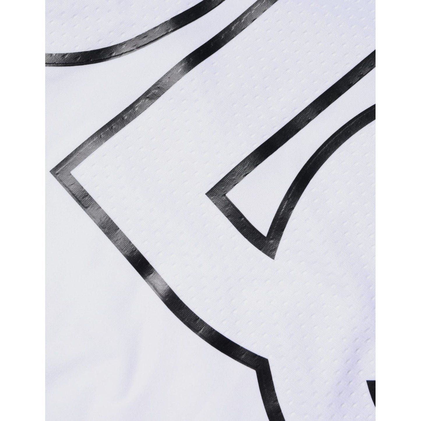 Close-up of Dolce & Gabbana white t-shirt with black logo print, showing detail of fabric texture and logo design.