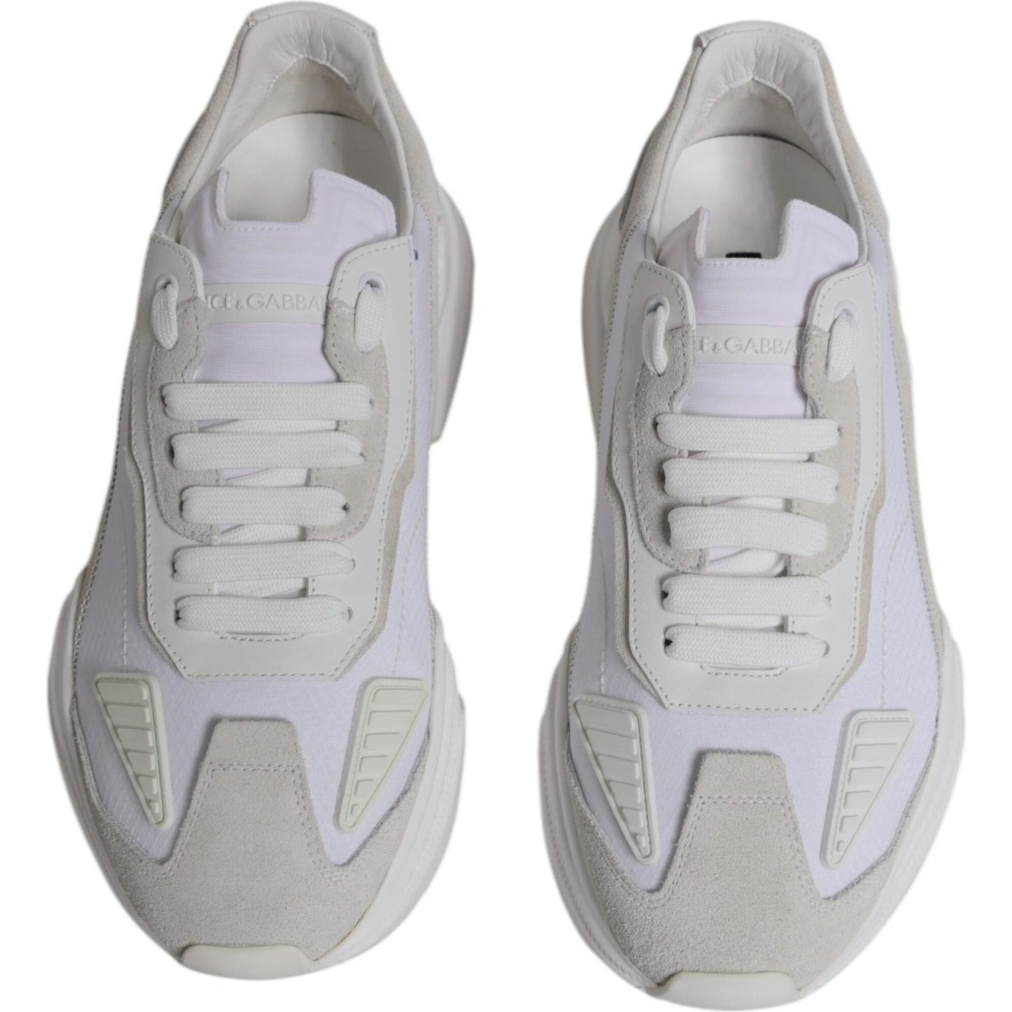 Dolce & Gabbana white leather Daymaster sneakers, low top with rubber sole and lace-up closure, featuring pen marks on the right shoe.