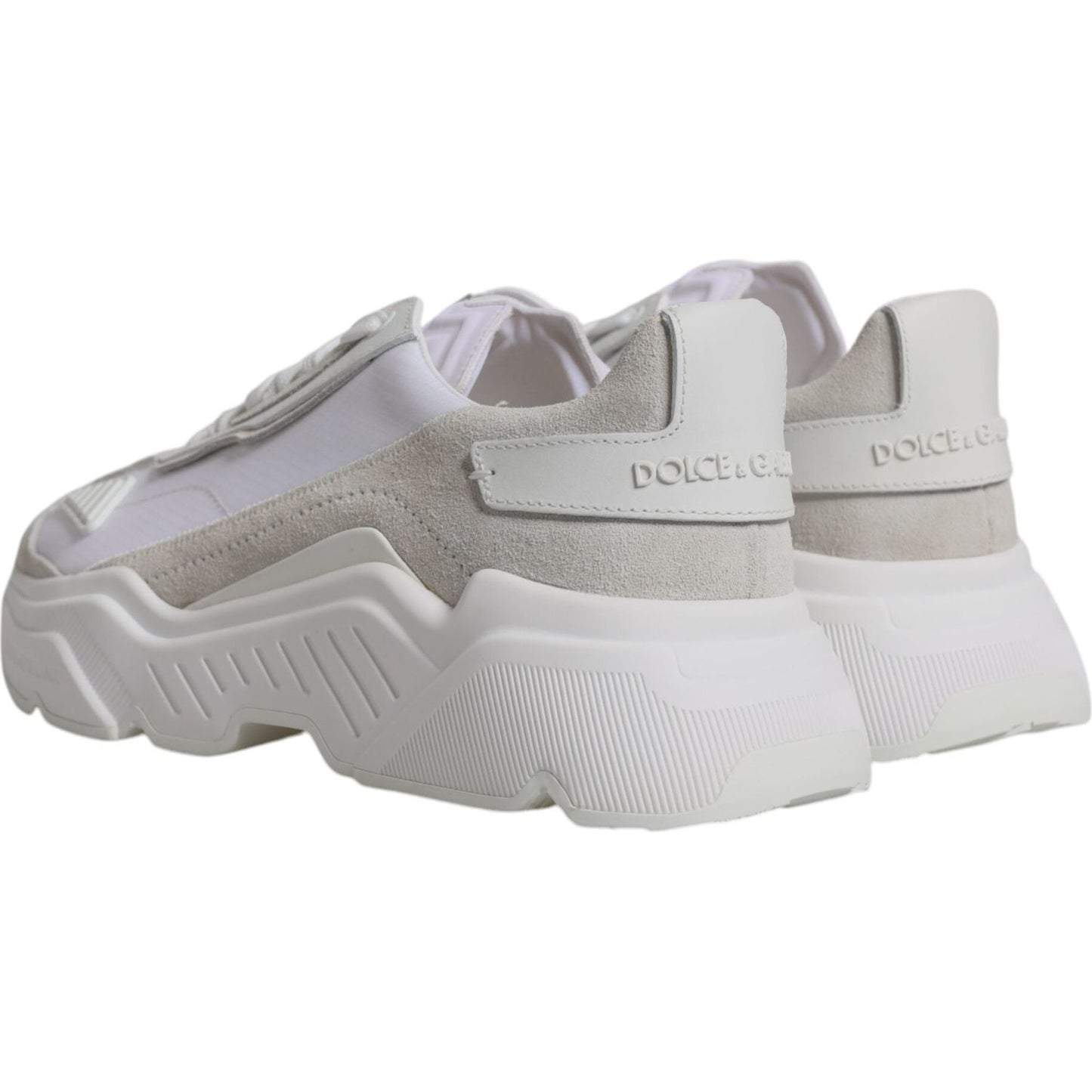 Dolce & Gabbana Daymaster white leather low-top sneakers with rubber sole and logo details, side view showing craftsmanship.
