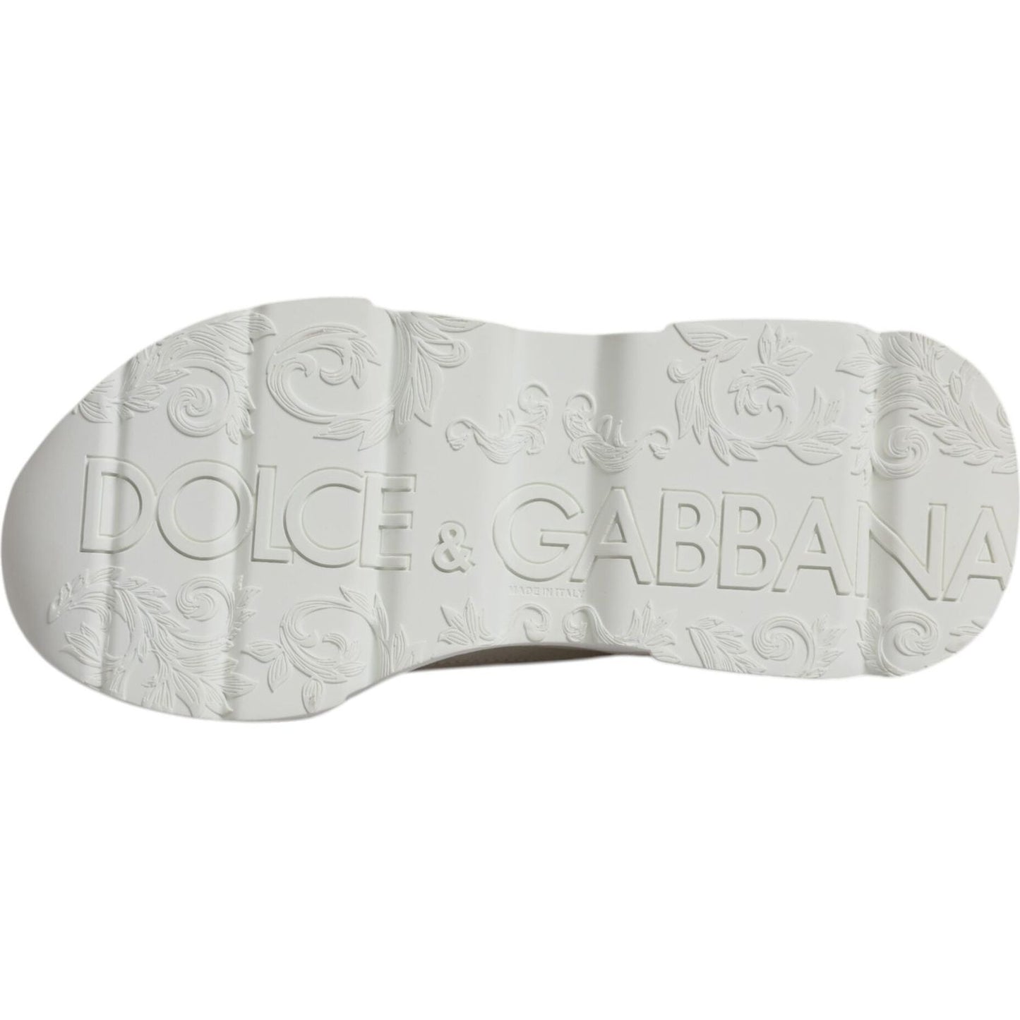 Sole of Dolce & Gabbana Daymaster sneakers, featuring embossed logo and floral design in white. High craftsmanship Italian leather shoes.