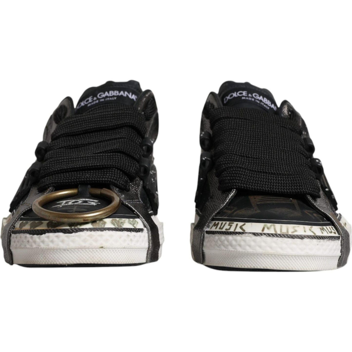 Dolce & Gabbana black and white Portofino sneakers with lace-up closure and rubber sole, showcasing logo details and unique design.