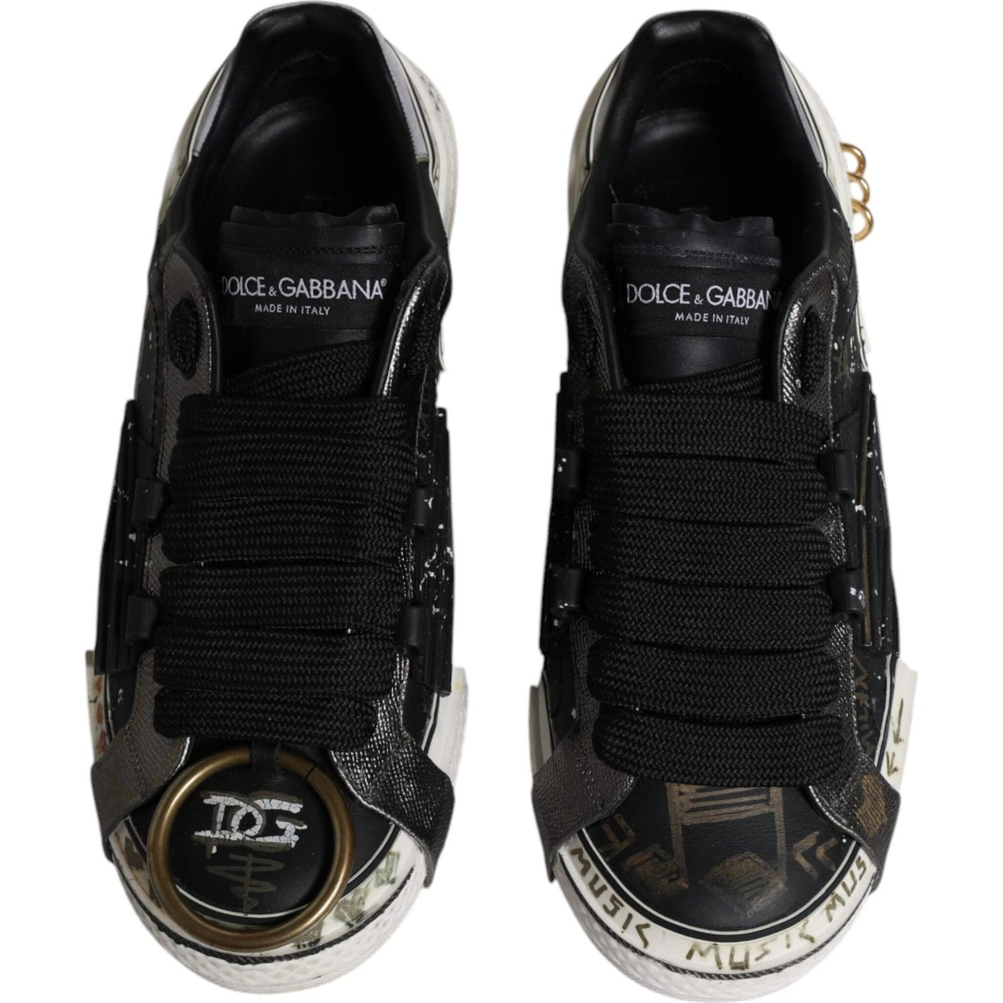 Dolce & Gabbana Portofino black and white leather low-top sneakers with logo details and rubber sole, preowned condition.