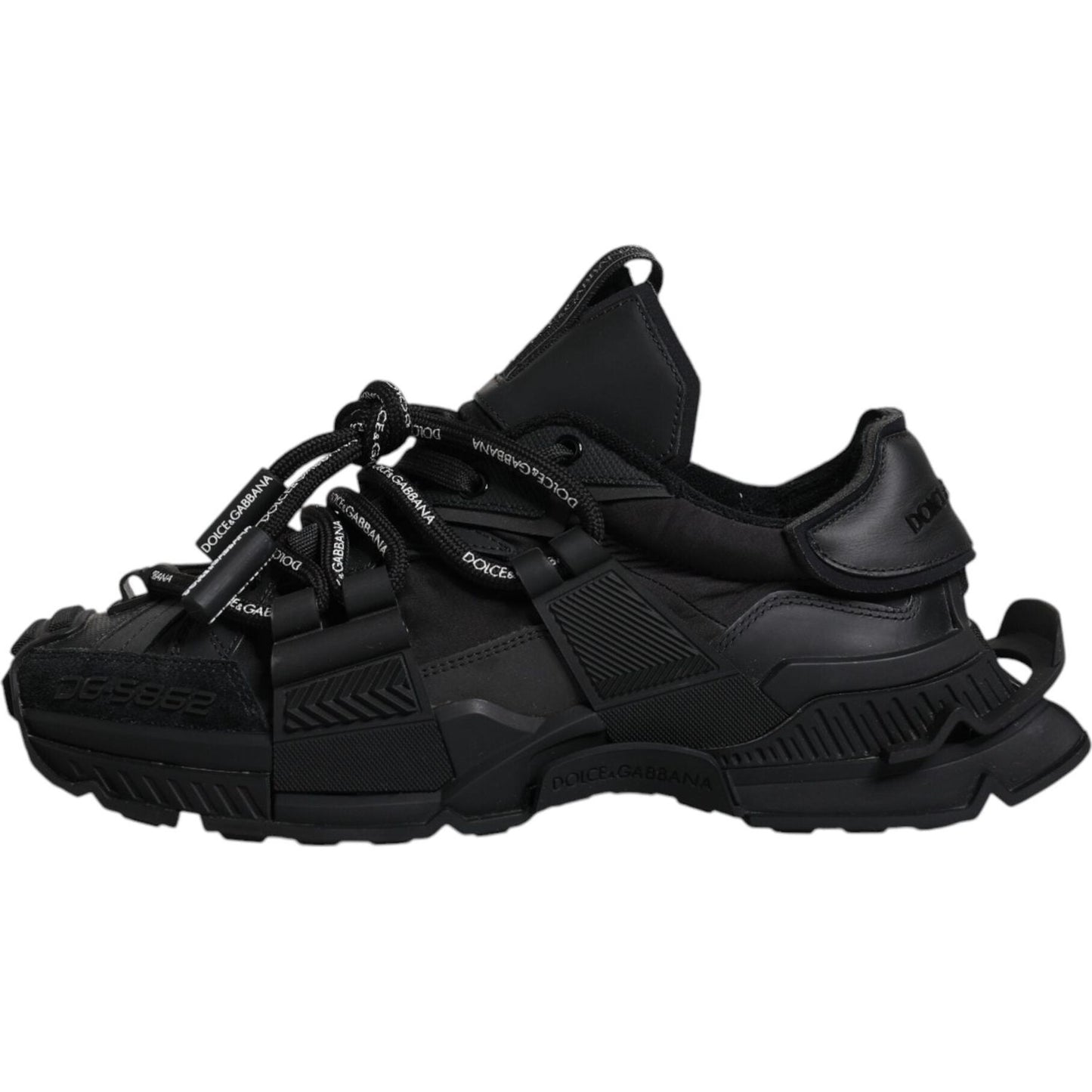 Dolce & Gabbana black low-top sneakers with lace-up closure and rubber sole, showcasing logo details, made in Italy.