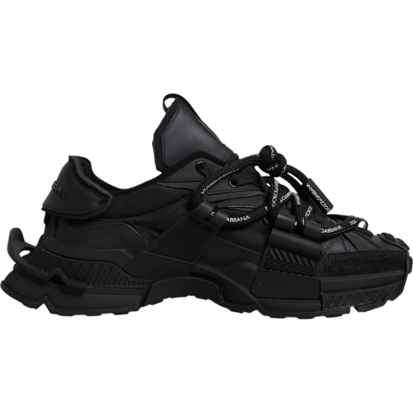Dolce & Gabbana black low-top sneakers with rubber sole and lace-up closure, featuring logo details, showcasing luxury craftsmanship.