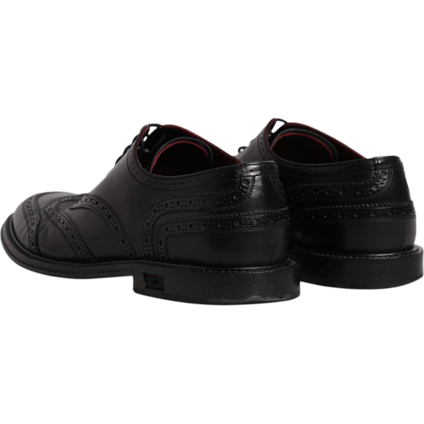Rear view of Dolce & Gabbana black leather derby wingtip formal shoes, showcasing intricate details, lace-up closure, and leather sole.