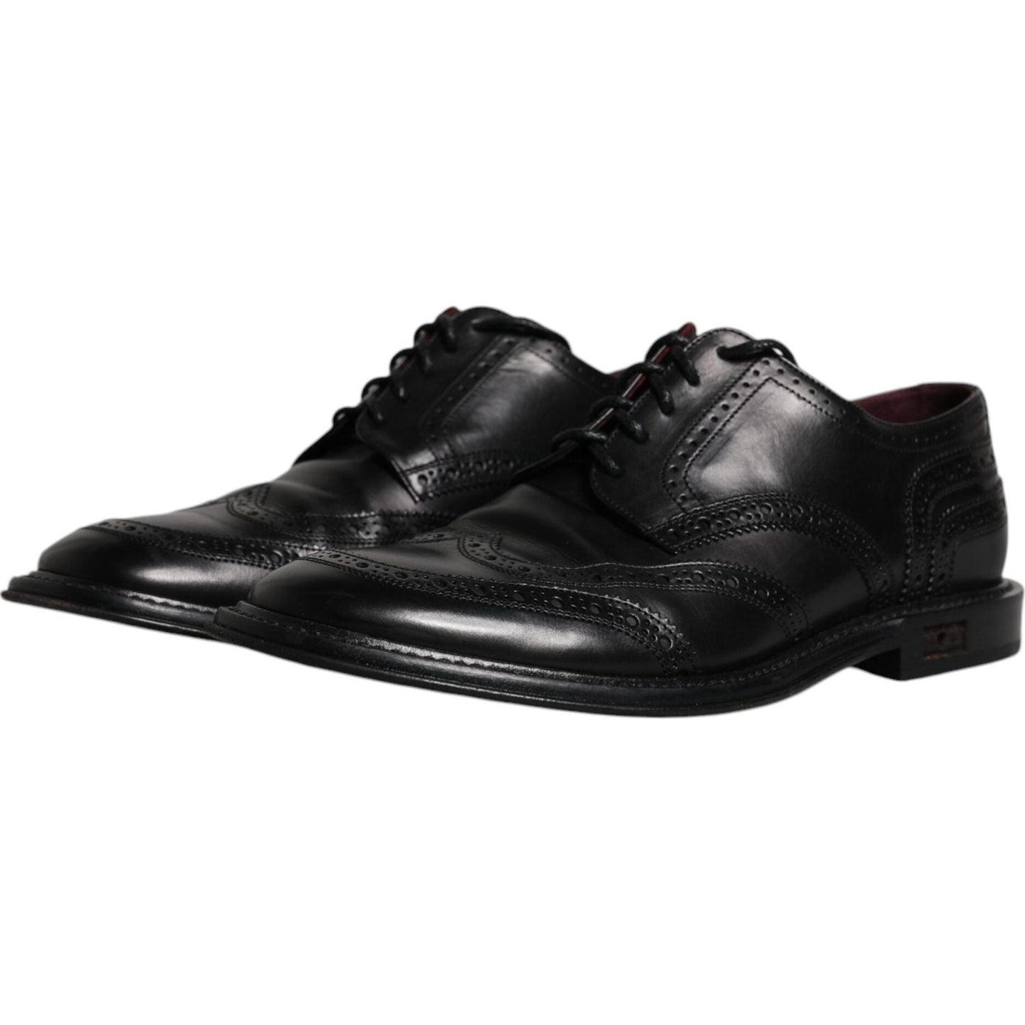 Dolce & Gabbana preowned black leather derby wingtip formal dress shoes, calfskin, lace-up, made in Italy, elegant craftsmanship.