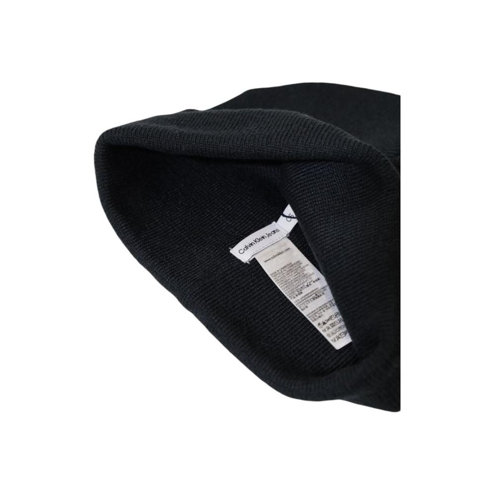 Interior view of Calvin Klein Jeans pink recycled polyester hat with care label showing sustainable material details.