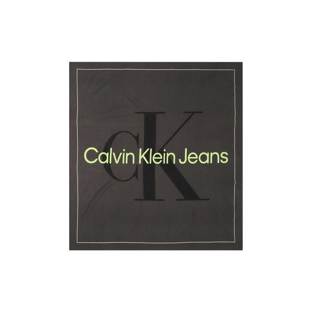Calvin Klein black organic cotton scarf with large CK logo and Calvin Klein Jeans text, highlighting modern and sustainable fashion.