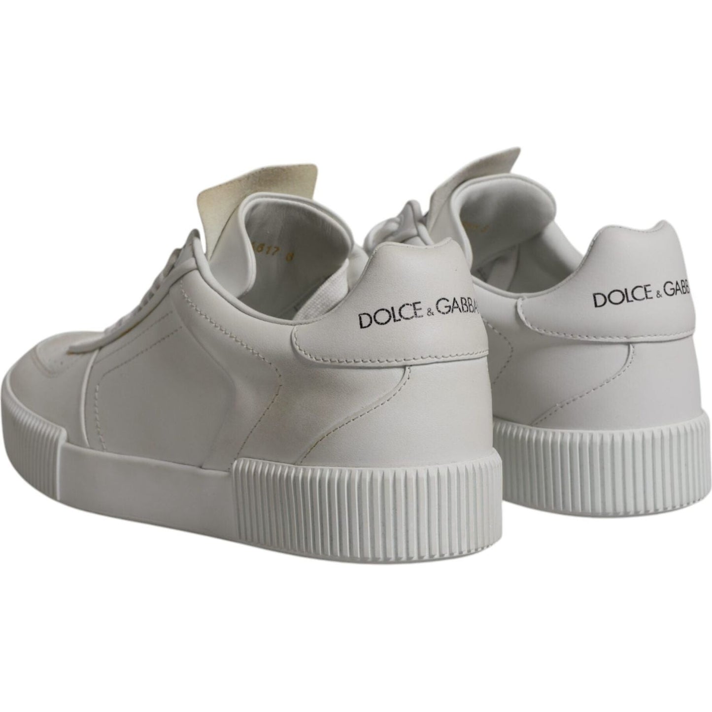 Dolce & Gabbana White Miami Leather Low Top Sneakers showing logo, rubber sole, lace-up closure; minor discoloration and glue marks visible.