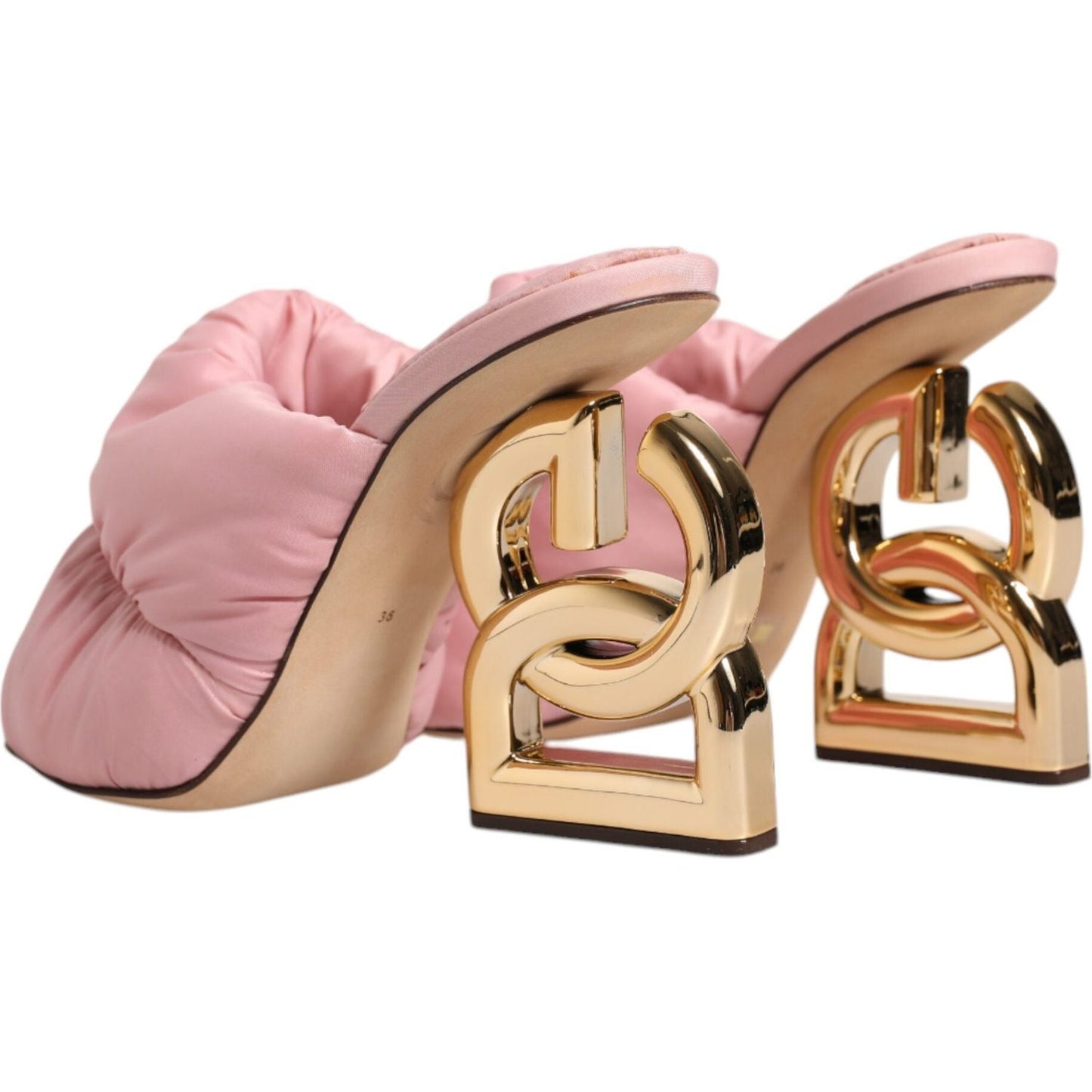 Dolce & Gabbana pink quilted slip-on sandals with gold DG sculpted heel and leather sole, displaying minor glue marks.