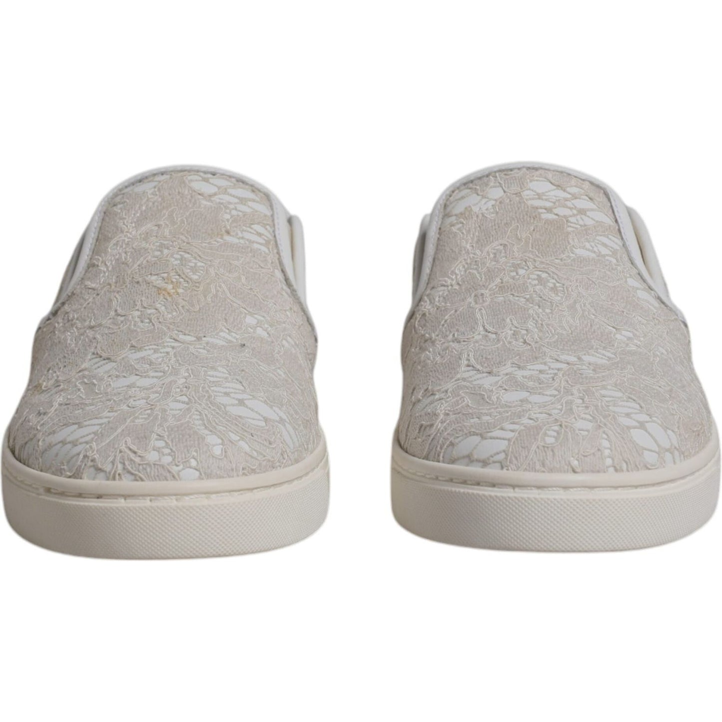 Dolce & Gabbana white floral lace slip-on loafers with minor glue marks, rubber sole, made in Italy, front view.
