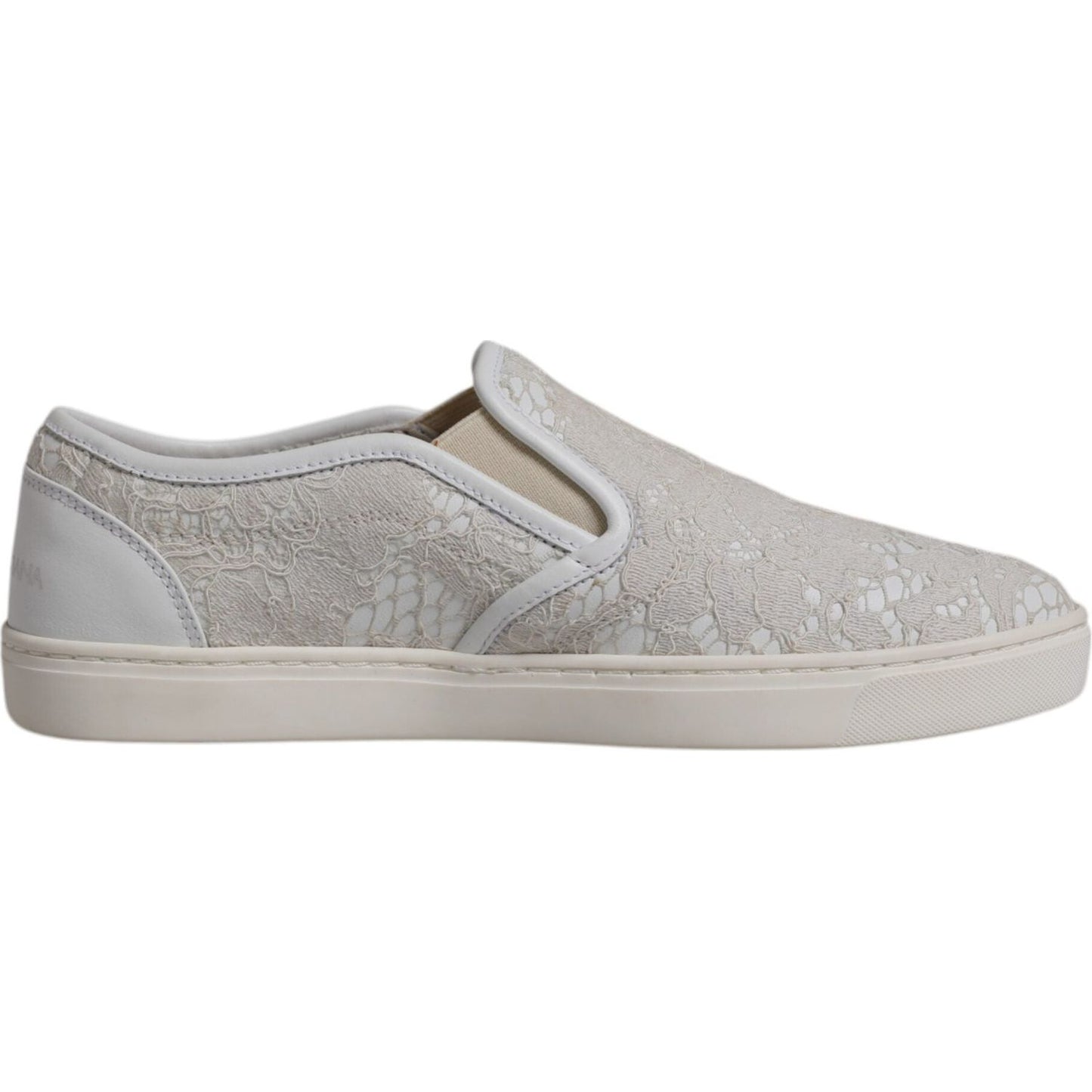 Dolce & Gabbana white floral lace slip-on loafers with rubber sole and logo detail, displaying minor glue marks, elegant and stylish.