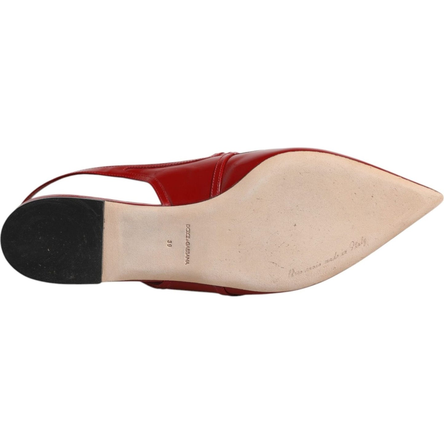 Bottom view of a Dolce & Gabbana red leather slingback flat sandal showing leather sole and logo details.