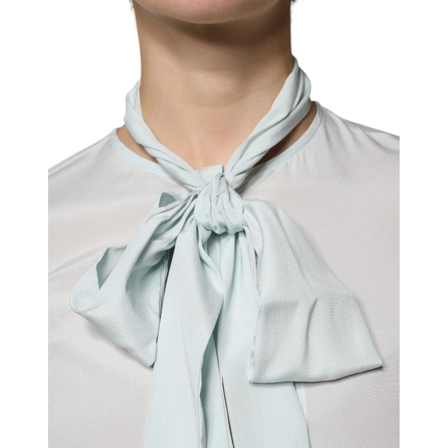 Ballantyne light blue silk ascot collared top with long sleeves and logo details, featuring a front knot close-up. Made in Italy.