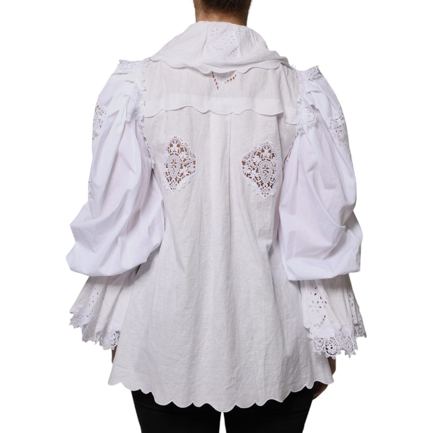 Dolce & Gabbana white cotton blouse with lace trim, rear view showing long sleeves and intricate detailing.