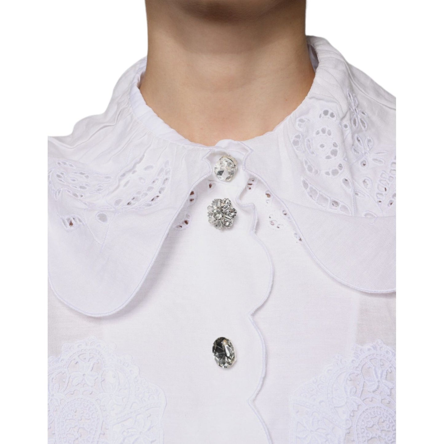 Dolce & Gabbana white cotton blouse with lace trim and collared design, featuring button front closure and logo details.