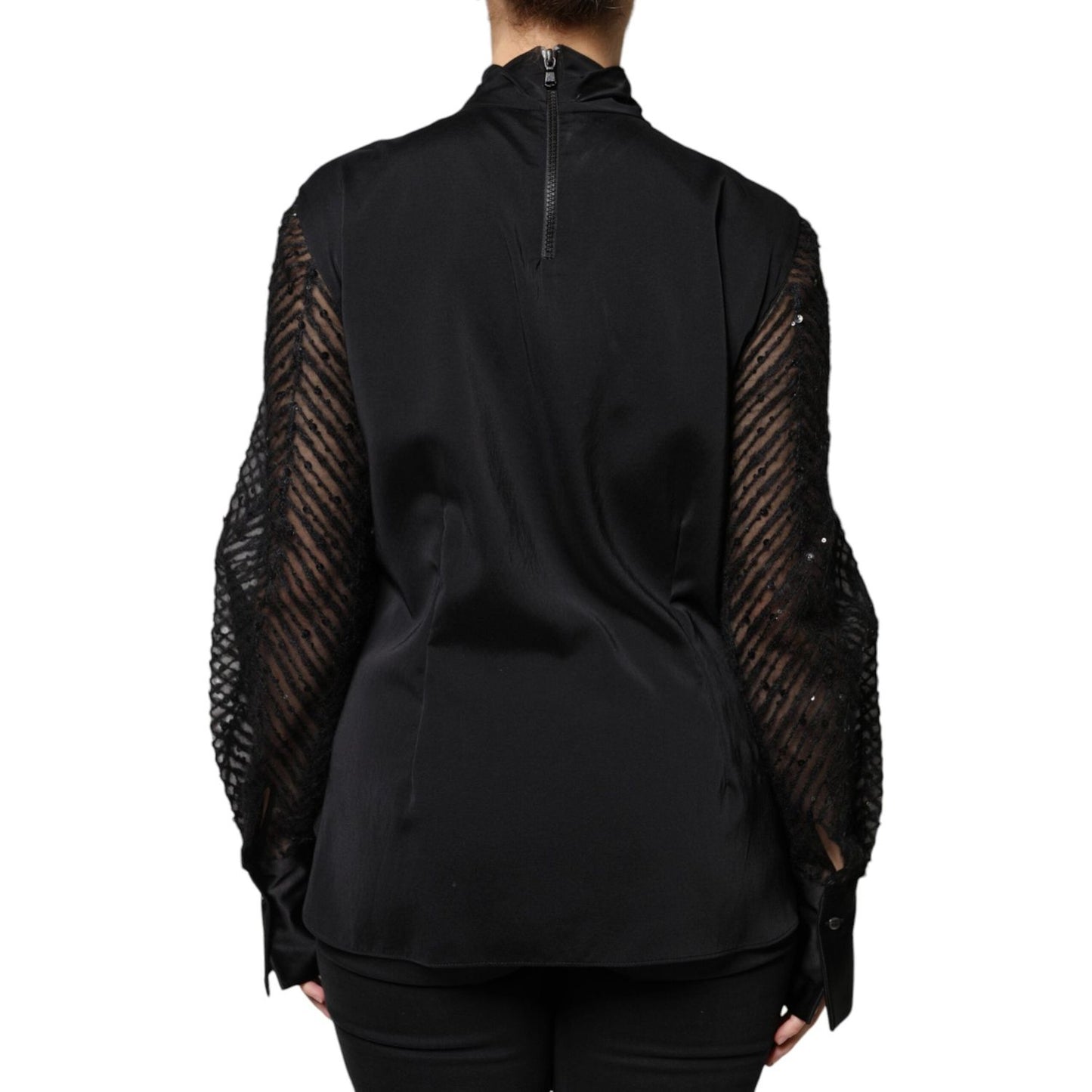 Back view of Brunello Cucinelli black silk blend blouse with long sleeves and turtleneck, featuring subtle pull threads on the front.