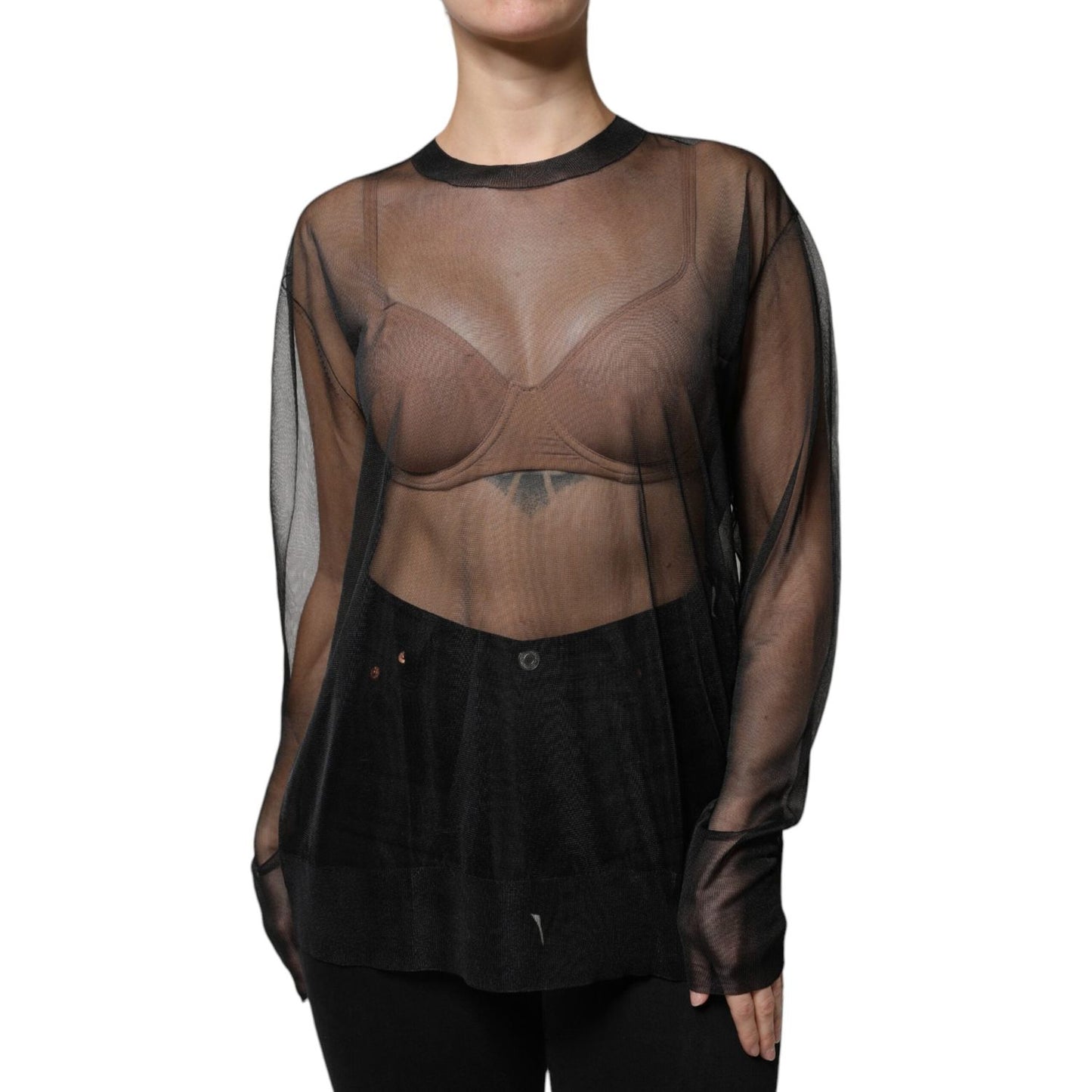Dolce & Gabbana black sheer long sleeve crewneck blouse with minor defect in pulled threads, crafted in Italy from 100% polyester.