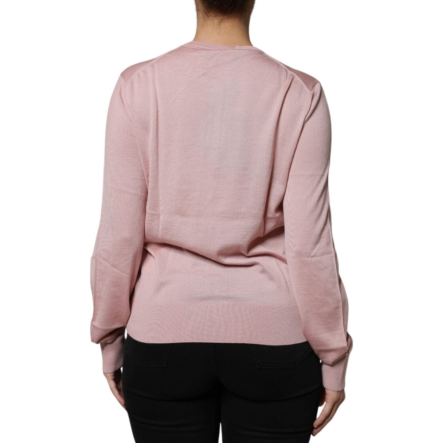 Back view of pink Dolce & Gabbana wool knit cardigan sweater, long sleeves, lightweight, crew neck, high craftsmanship, no pockets.