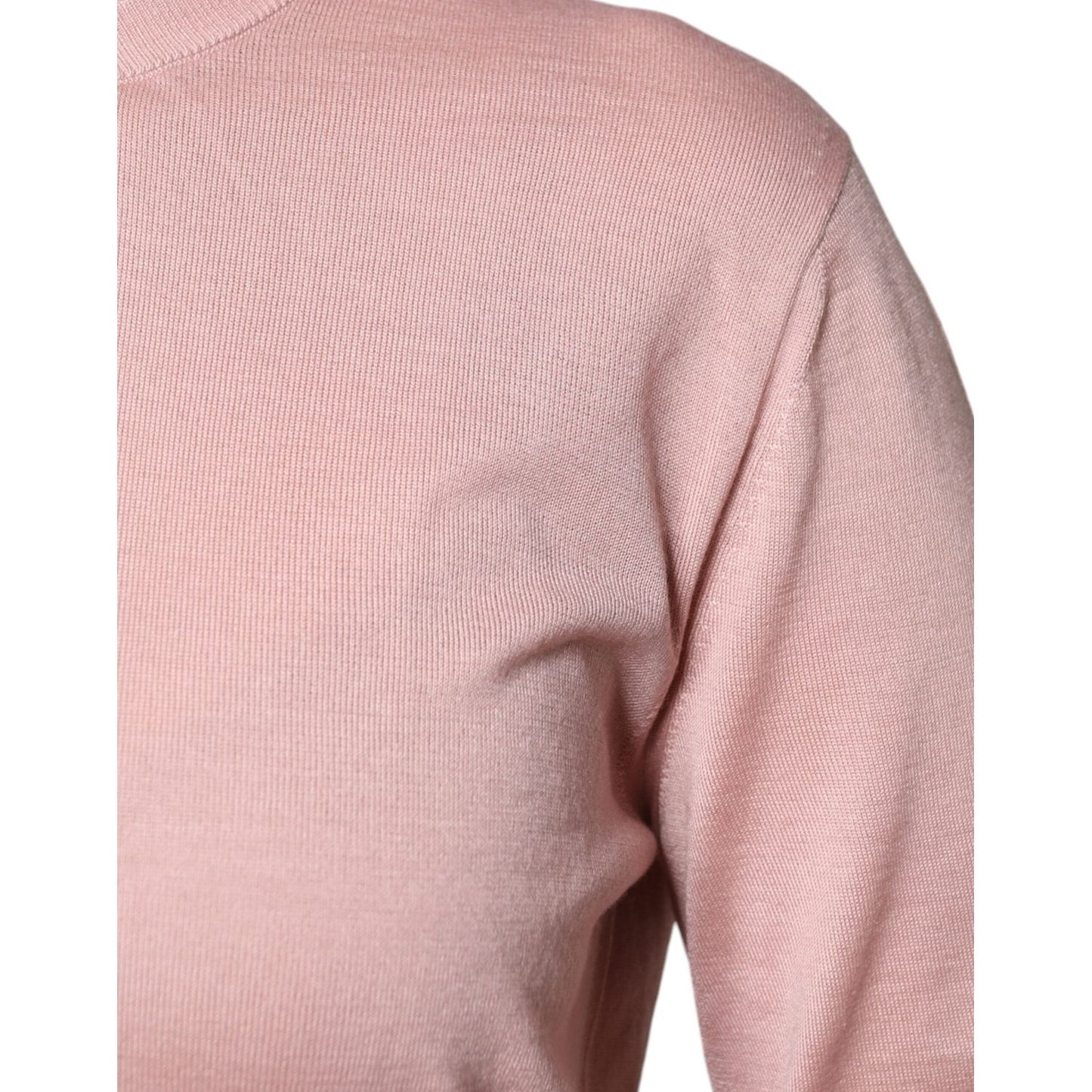 Dolce & Gabbana pink wool knit cardigan sweater, close-up of fabric texture and solid color.