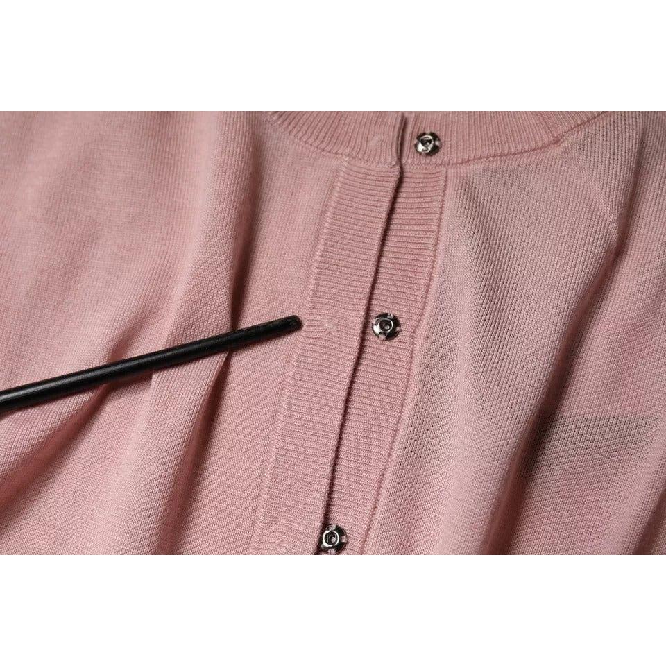 Dolce & Gabbana pink wool cardigan sweater showing button closure detail and minor defect, made in Italy, luxury fashion item.