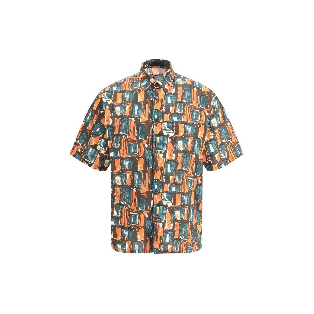 Prada Batista squared cotton shirt with vibrant multicolored geometric pattern, short sleeves, classic collar, and tone-on-tone buttons.
