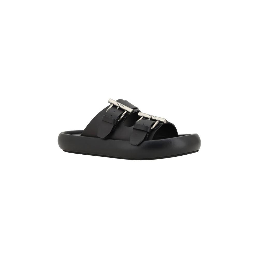 Alexander McQueen black leather sandals with metal buckles and logo embossed, featuring bold design and convex sole.