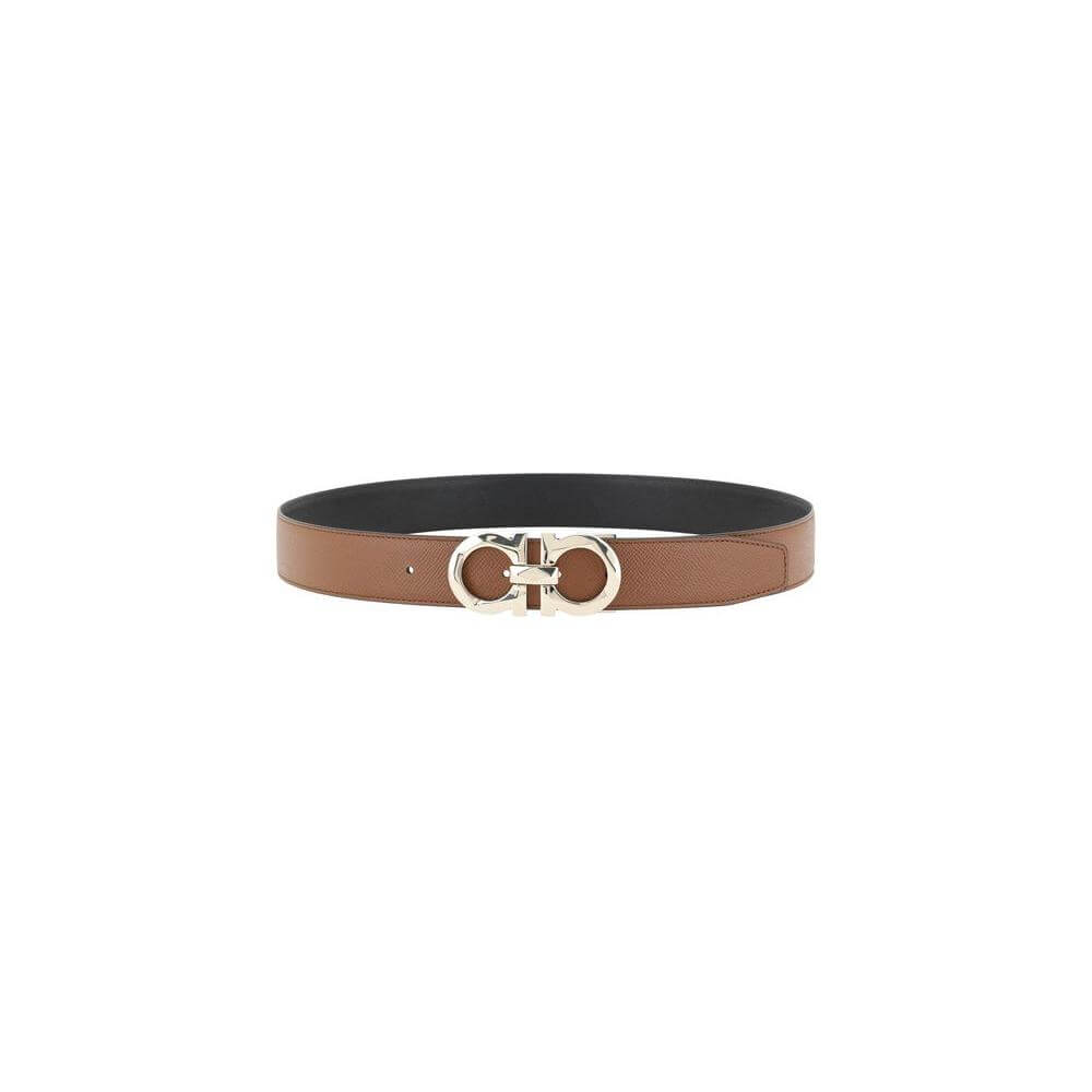Ferragamo Gancini reversible leather belt with 3D buckle and iconic logo, offering two stylish monochrome leather options.