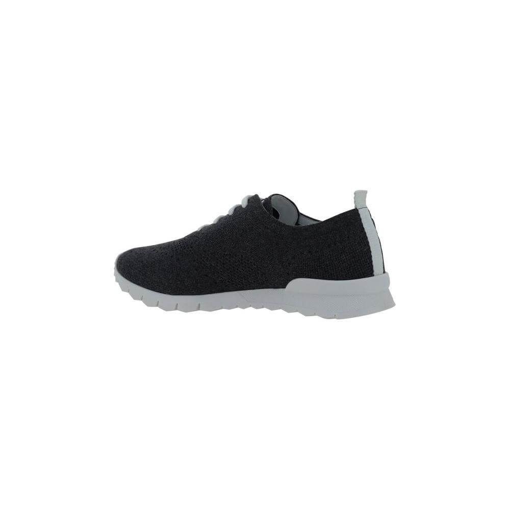 Side view of black Kiton sneaker with lace-up closure, mesh design, and branded heel pull on white sole.