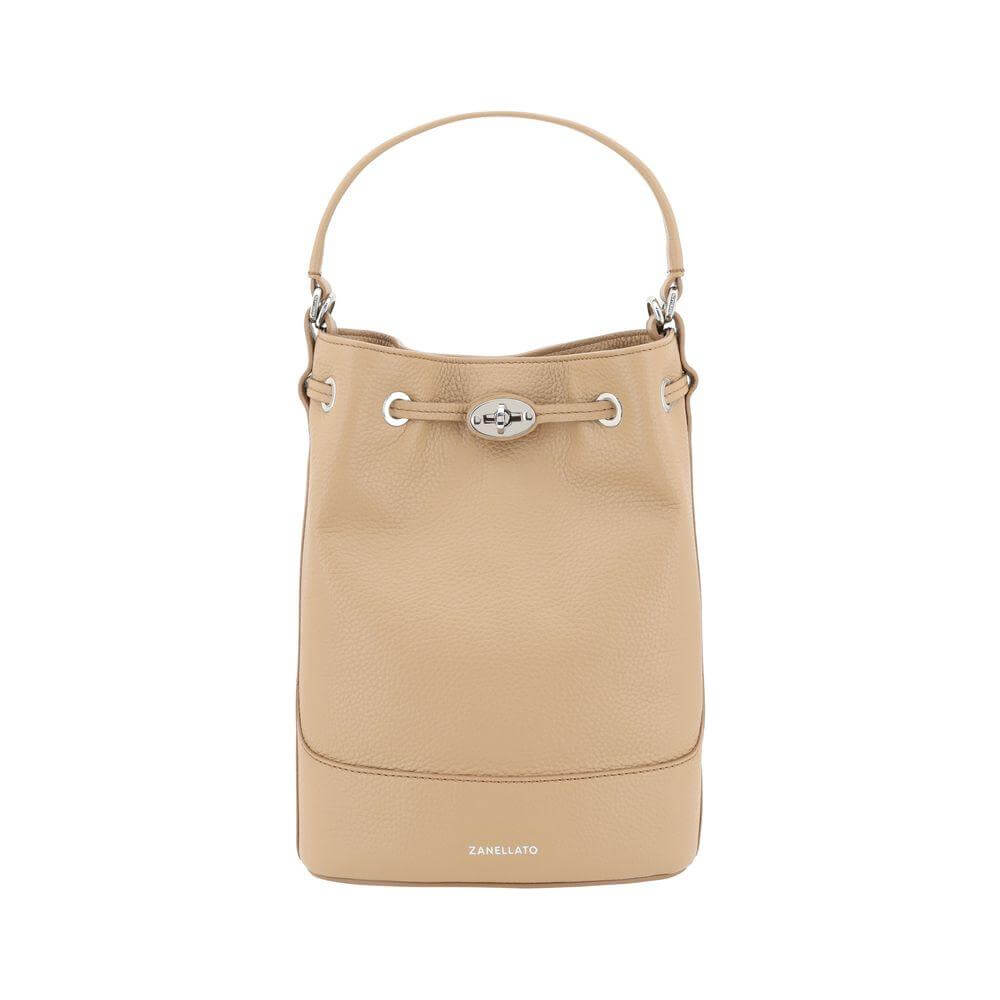 Zanellato Monda Bucket Bag in beige grained leather with drawstring closure, top handle, and iconic monogram on front.