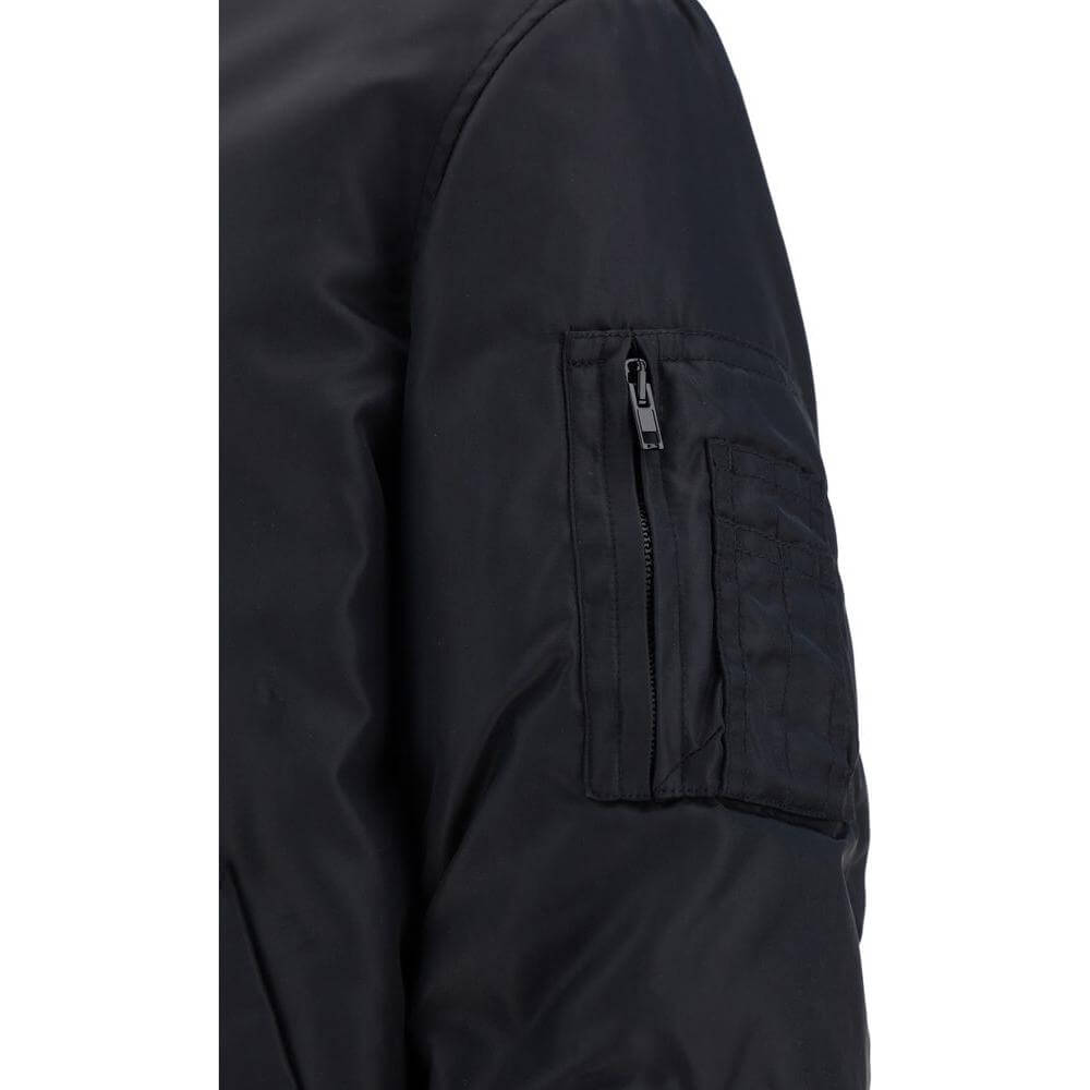 Close-up of Moschino bomber jacket sleeve with zipper pocket and quilted design.