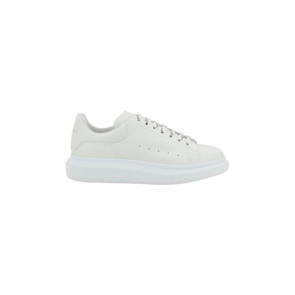 Alexander McQueen leather sneakers with platform sole, lace-up front, logoed heel, and round toe design in white.