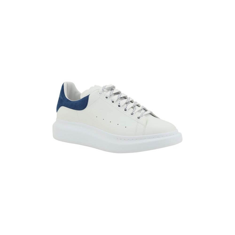 White Alexander McQueen leather sneaker with lace-up closure and blue suede heel, elegant and modern design.