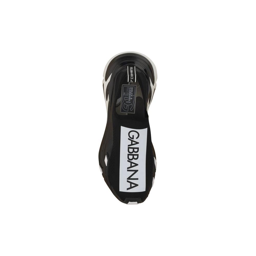 Top view of Dolce & Gabbana sneakers showcasing round toe, textured panelled sole, slip-on style, and contrasting front logo label.