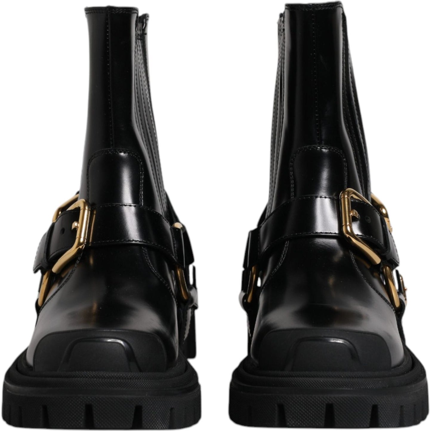 Dolce & Gabbana black leather mid calf slip on trekking boots with gold metal detailing and rubber sole, view of front design