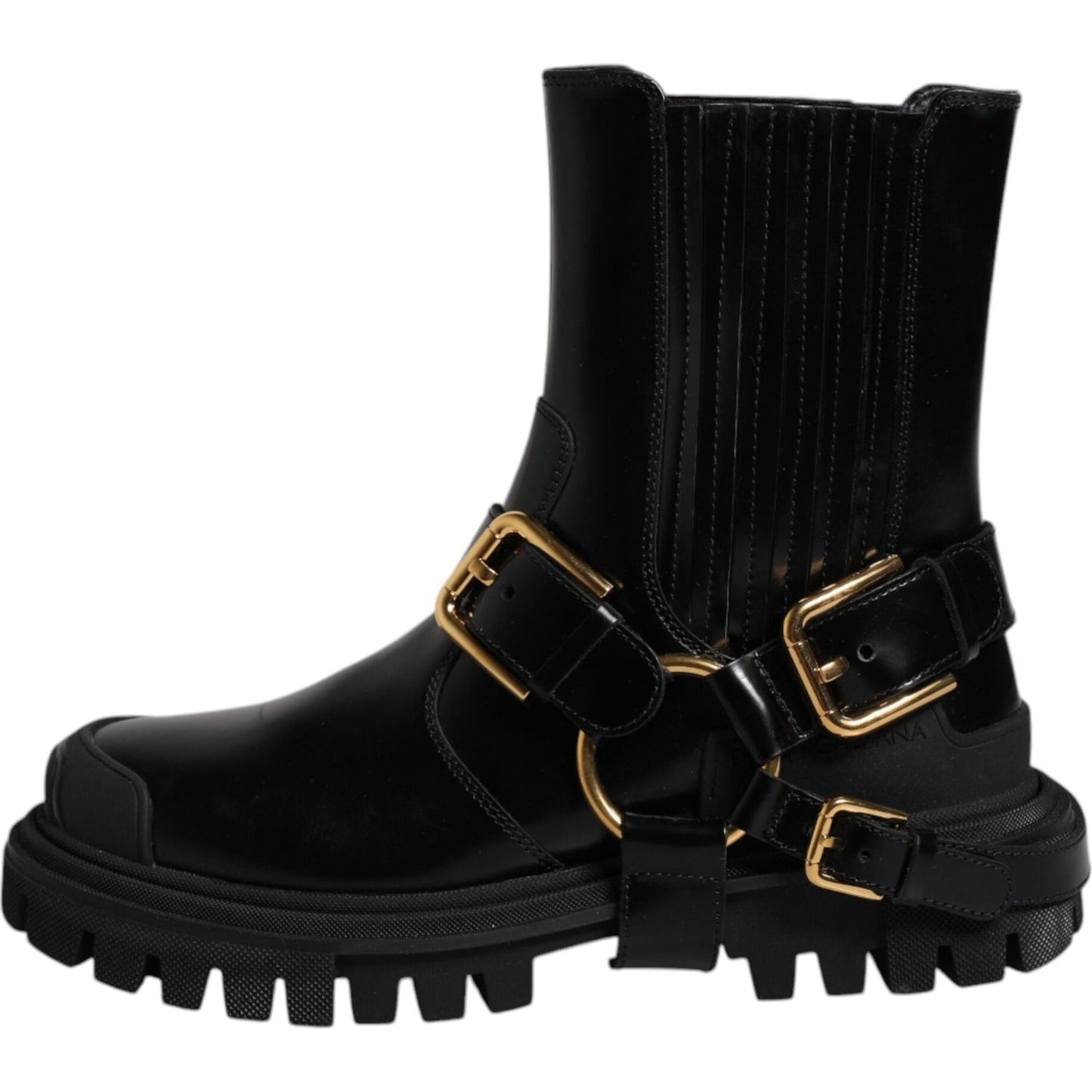 Dolce & Gabbana black leather mid-calf trekking boots with gold details, rubber sole, and minor scratches. Exclusive, Made in Italy.